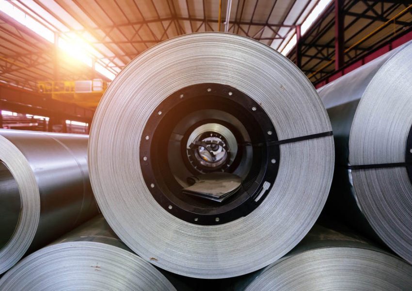 Rolls of galvanized steel sheet inside the factory or warehouse.
